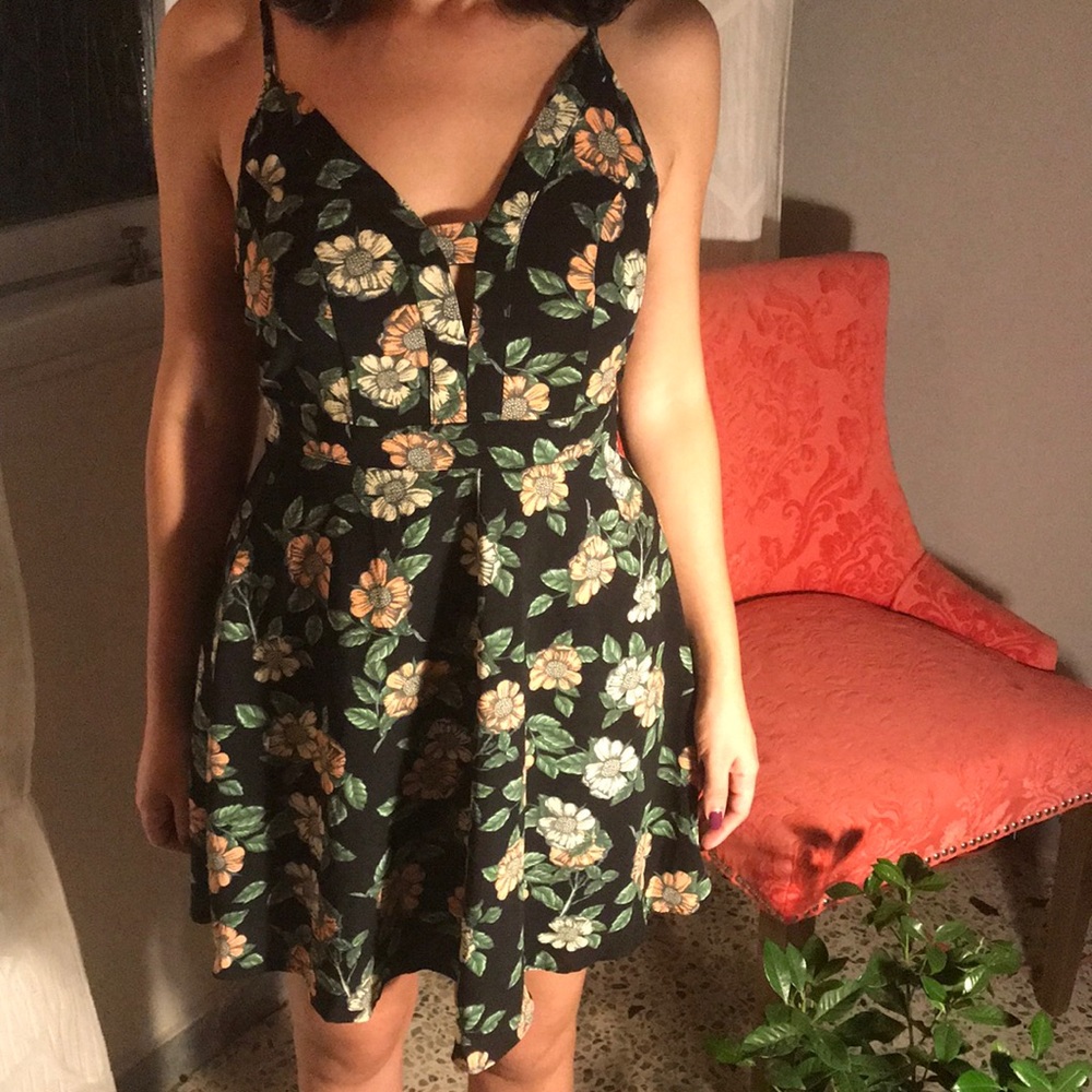 Floral dress with adjustable straps.
